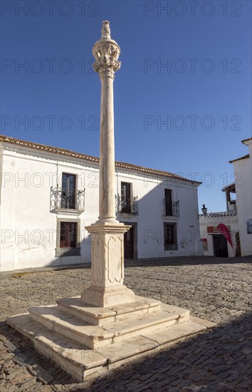 Marble post reputedly used for slave auctions in side historic walled hilltop village of Monsaraz,