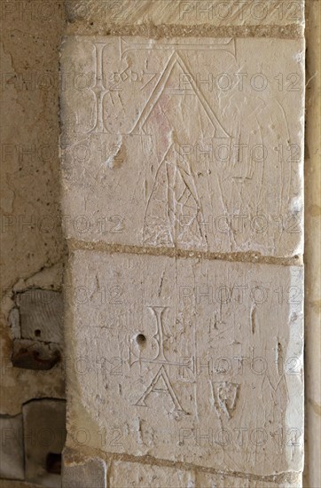 Initials names graffiti carved into stone of doorway at Church of St George South Elmham St Cross,