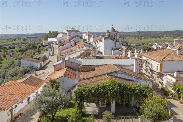 View over rooftops of whitewashed houses and streets in the small rural settlement village of