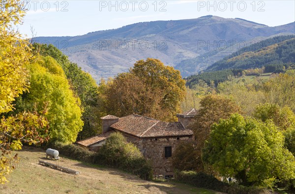 Autumnal countryside landscape view of mountains, Nuestra Senora de Tres Fuentes church, Valganon,
