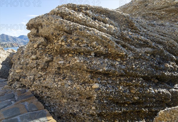 Close up of coastal cliff composed of conglomerate sedimentary rocks at Nerja, Andalusia, Spain,