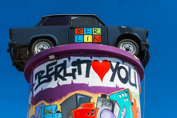Trabant on an advertising pillar, sculpture, memory, monument, car, GDR, East Germany, colourful,