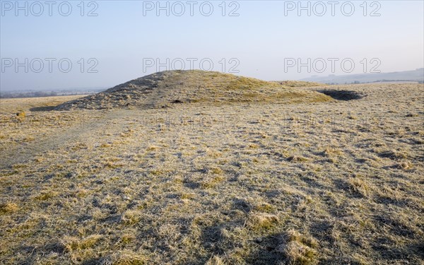Bronze Age bowl barrow on Windmill Hill, a Neolithic causewayed enclosure, near Avebury, Wiltshire,