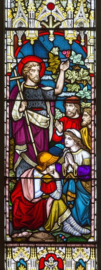 Stained glass window in church of Saint John the Baptist, Badingham, Suffolk, England, UK circa