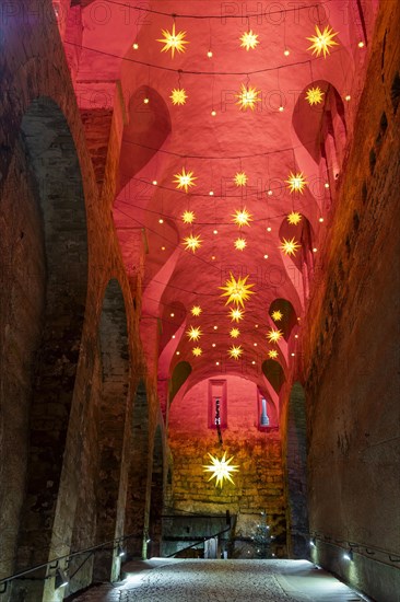 Winter atmosphere at the mountain fortress. Dark appareille with Advent stars, Koenigstein, Saxony,