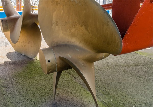 Closeup of large metal propeller on retired frigate on display at public park in Seosan, South