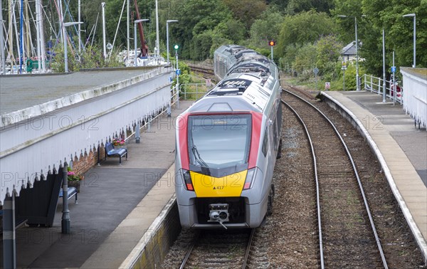 British Rail Class 755 Stadler bi-modal train leaving railway station at Woodbridge, Suffolk,