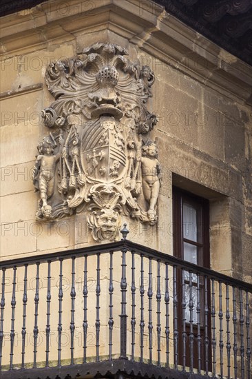 Stonework detail of coat of arms on wall of building, village of Elceigo, Alava, Basque Country,