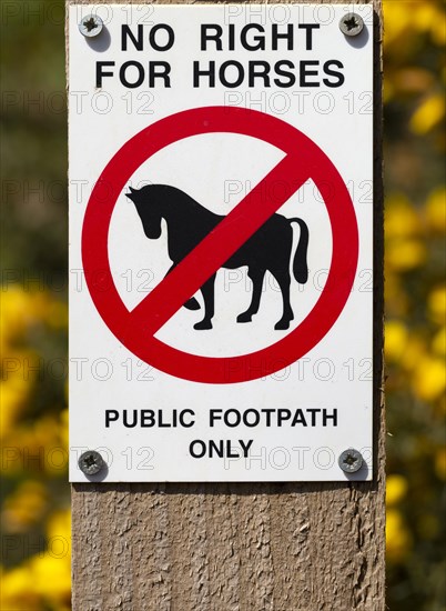 Macro close up No Right For Horses Public Footpath Only sign on fencepost, Sutton, Suffolk,