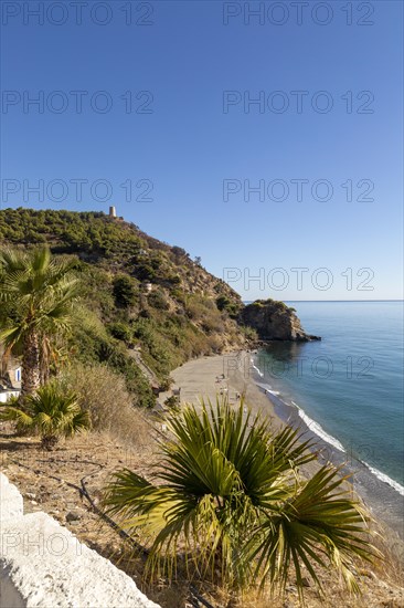 Sandy beach of Playa de Maro, near Nerja, Andalusia, Spain with calm Mediterranean Sea, out of