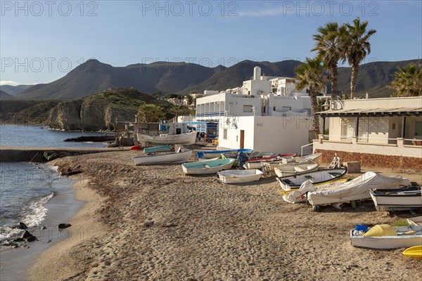 Small boats dinghies on sandy beach at Isleta del Moro, Cabo de Gata natural park, Almeria, Spain,