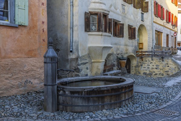 Wooden fountain, house with sgraffito, facade decorations, historic houses, Guarda, Engadin,
