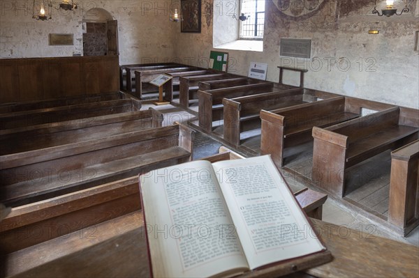 Medieval frescoes church of Saint Mary, Kempley, Gloucestershire, England, UK, bible on pulpit