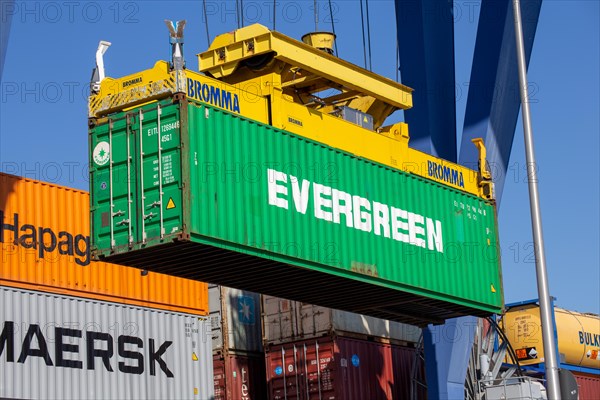 An Evergreen Line container is loaded in the port of Mannheim, Germany. Supply bottlenecks and a