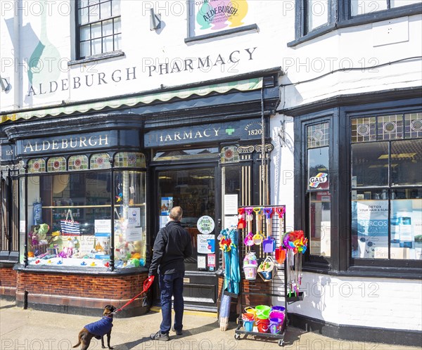 Aldeburgh pharmacy shop, Aldeburgh, Suffolk, England, UK traditional shop frontage and window