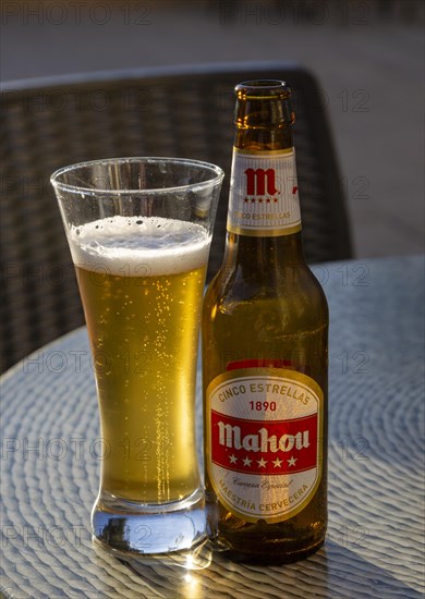 Glass and bottle of Mahou Cinco Estrellas 1890 cerveza especial beer, Maestria Cervecera, Spain,