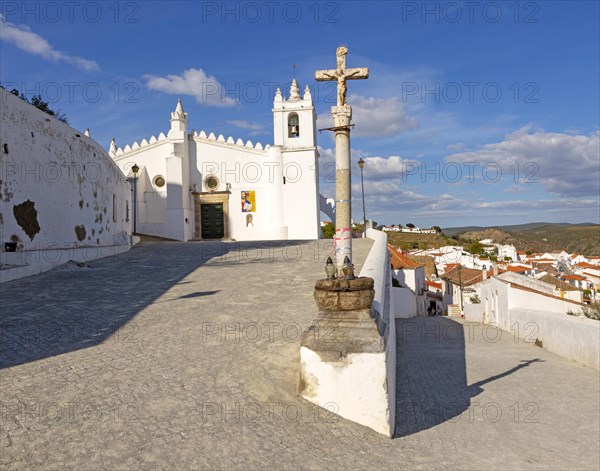 Historic whitewashed church Igreja Matrix in medieval village of Mertola, Baixo Alentejo, Portugal,