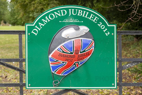 Sign for Diamond Jubilee 1952-2012 on gate entrance to public park, Netheravon, Wiltshire, England,