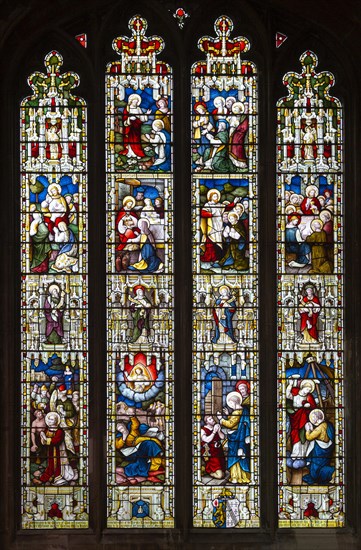 Stained glass window East Bergholt church, Suffolk, England, UK, five tiers of biblical scenes c