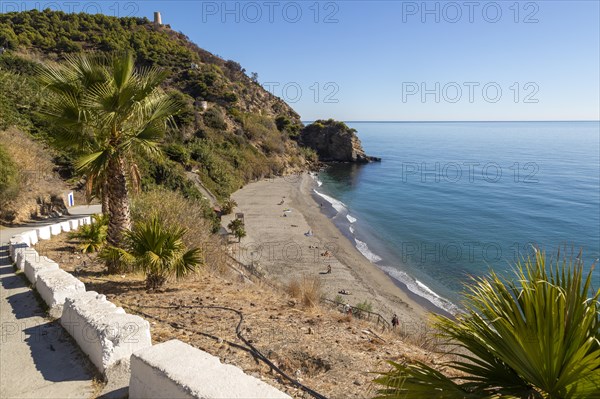 Sandy beach of Playa de Maro, near Nerja, Andalusia, Spain with calm Mediterranean Sea, out of