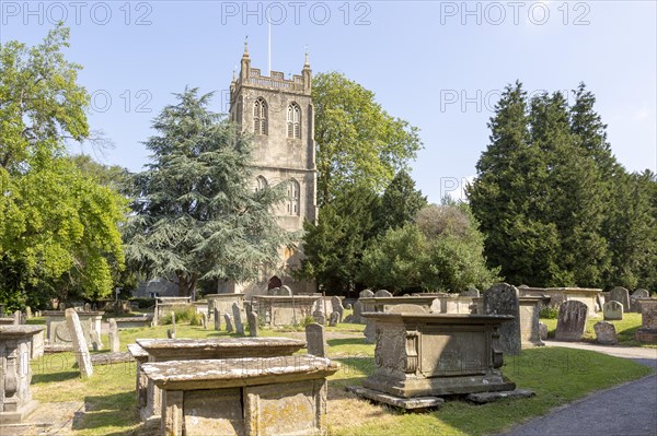 Tower of church of Saint Mary, Berkeley, Gloucestershire, England, UK gravestones and chest tombs