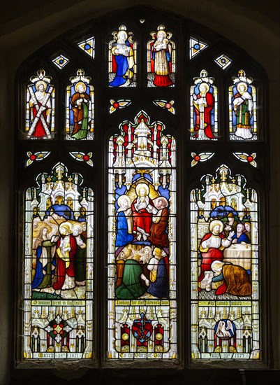 Stained glass window East Bergholt church, Suffolk, England, UK, Acts of Mercy c 1873 by Lavers,