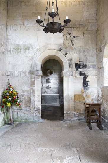 Interior stone arch leading to altar inside Saxon church of Saint Laurence, Bradford on Avon,