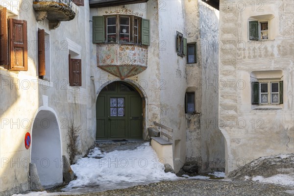 Bay window, entrance door, historic house, sgraffito, facade decorations, Guarda, Engadin, Grisons,