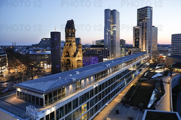View of Breitscheidplatz in the evening with the Bikini building, the Kaiser Wilhelm Memorial