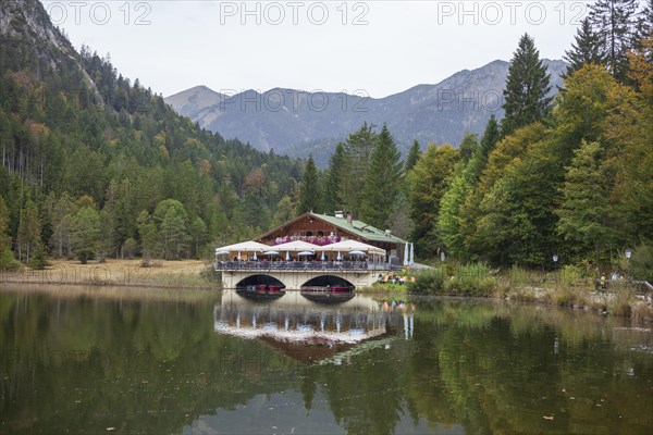 Pflegersee with inn under a cloudy sky, Garmisch-Partenkirchen, Werdenfelser Land, Upper Bavaria,