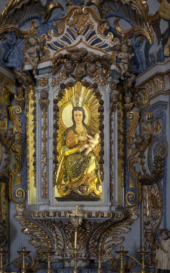 Ornately decorated statue of Blessed Virgin Mary 17th century church of Igreja de Santiago, Tavira,