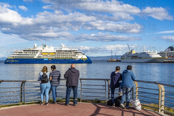 People watching cruise ships in the harbour at the Beagle Channel, Ushuaia, Tierra del Fuego