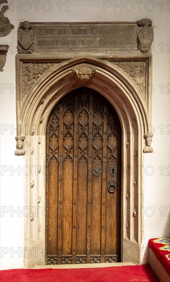 Interior of church of Saint Mary, Halesworth, Suffolk, England, UK, Vestry door dating from late