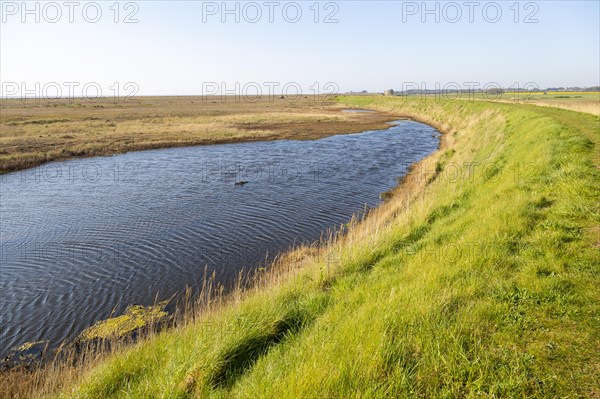 Water in lagoon between shingle beach and sea wall dyke, Alderton, Suffolk, England, UK, North Sea