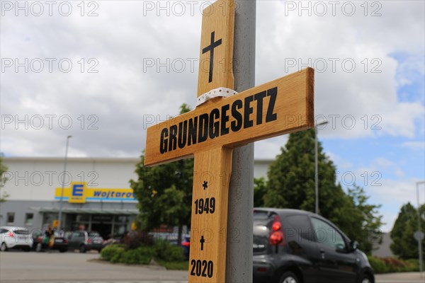 Symbolic grave cross with inscription on the Basic Law at a protest organised by critics of the