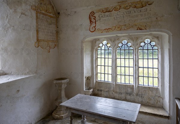 Chancel All Saints church, Leigh, Wiltshire, England, UK interior with ancient wall texts old