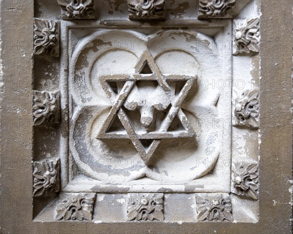 Historic interior of East Bergholt church, Suffolk, England, UK baptismal font stonework detail