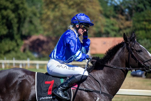 Race day at the racecourse in Hassloch, Palatinate. Galloping out after the Mueller Bau GmbH Prize