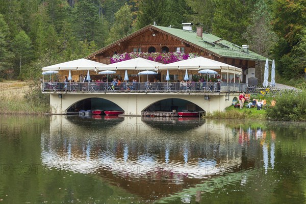 Pflegersee with inn under a cloudy sky, Garmisch-Partenkirchen, Werdenfelser Land, Upper Bavaria,