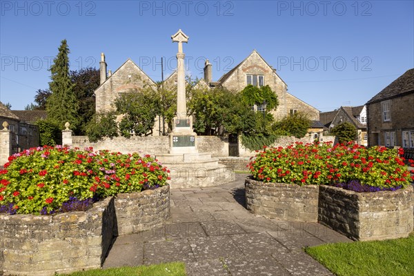Historic Cotswold stone buildings and war memorial in Canon Square, Melksham, Wiltshire, England,