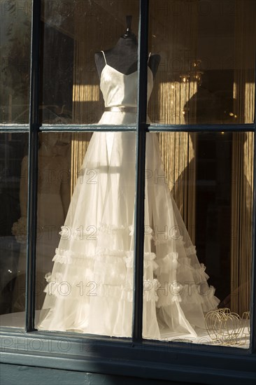 Wedding dress in shop window Amelia and Alci bridal boutique shop, Market Hill, Woodbridge,