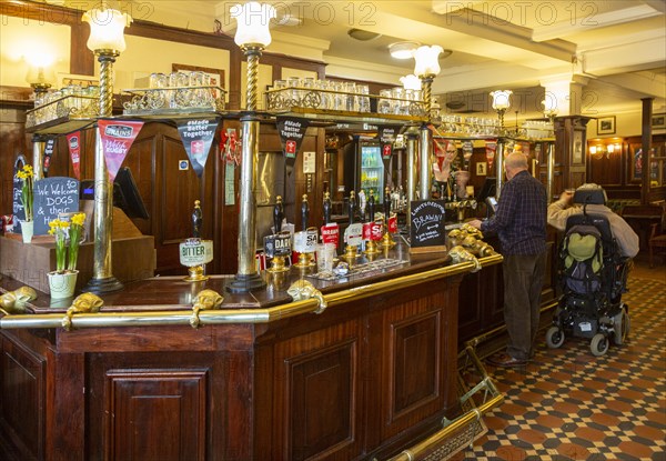 Interior of historic Goat Major pub in city centre of Cardiff, South Wales, UK, bar with Brains