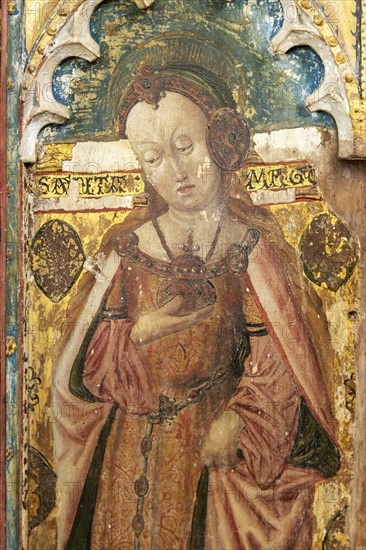 Medieval paintings of saints on rood screen inside church of Saint Andrew, Bramfield, Suffolk,