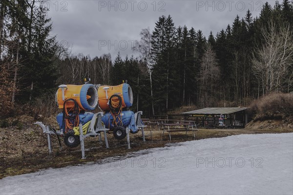 Snow cannons, photographed on a ski slope in the Jizera Mountains ski resort near Albrechtice v