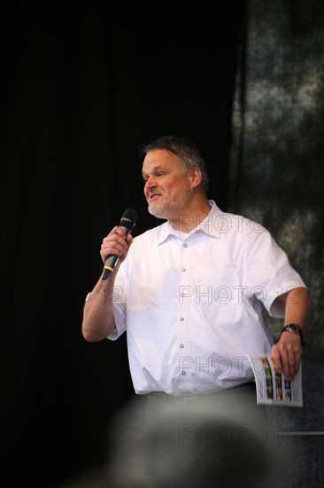 Molecular biologist Dr Stefan Lanka speaks at the large-scale lateral thinking demonstration in