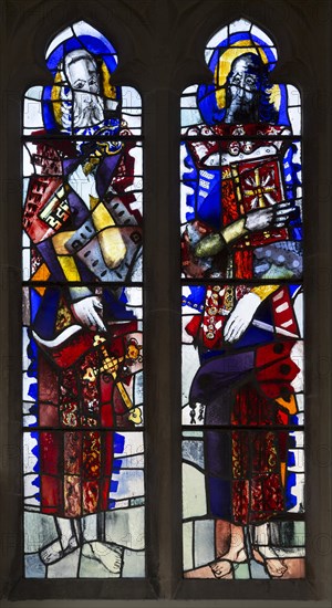 Modern stained glass window in church of Saints Peter and Paul, Marden, Wiltshire, England, UK by