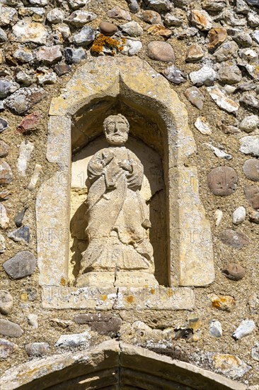 Church Holton, Suffolk, England, UK small statue of Saint Peter in porch niche