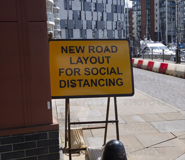 Sign for new road layout for social distancing, Wet Dock waterfront, Ipswich, Suffolk, England, UK