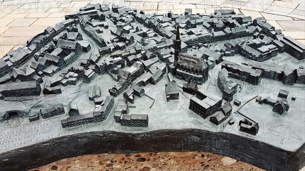The historic city centre of Dingolfing with a view of the bronze city map. Dingolfing, Lower