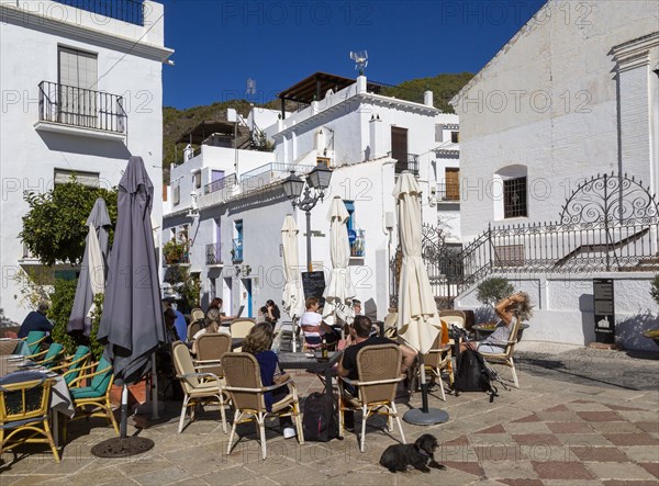 People and cafes in church square plaza, Plaza de la Iglesia, Frigiliana, Axarquia, Andalusia,